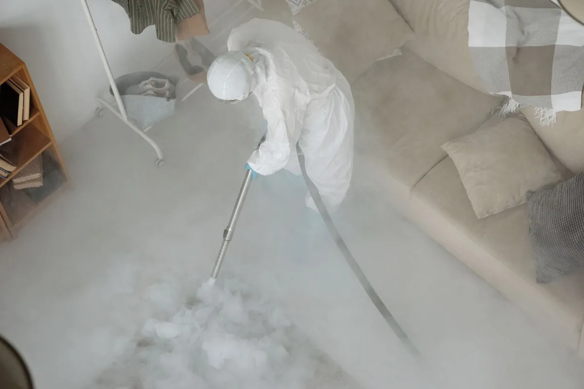 Biohazard cleanup technician in protective equipment, Brandon, MS